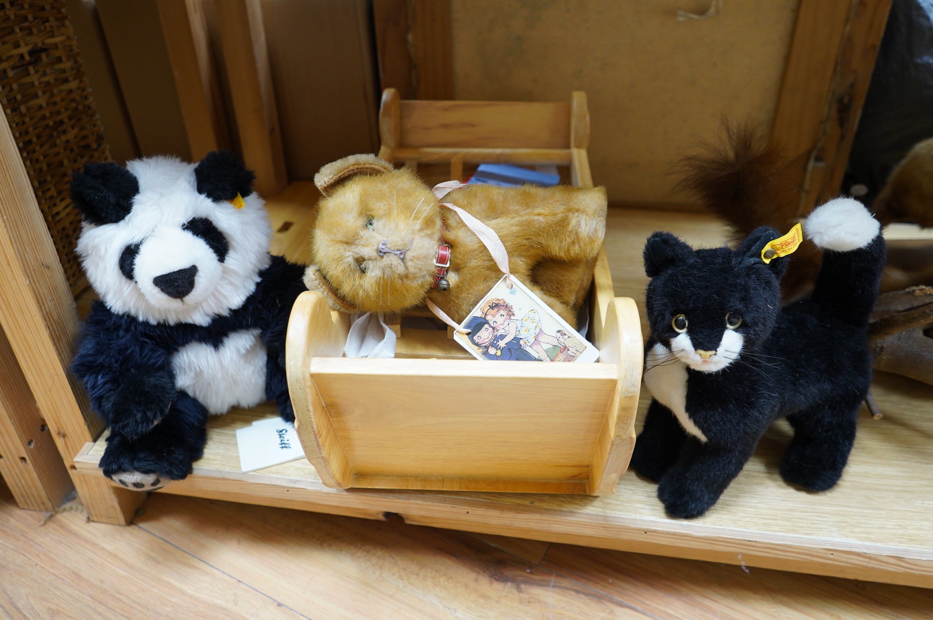 A modern Sri Lankan wood Noah's Ark and animals, a Steiff black cat and panda and another soft toy cat. Noah's Ark 54cm long. Condition - good